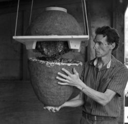 Michael Joshin Thiele holding beehive without protective gear.