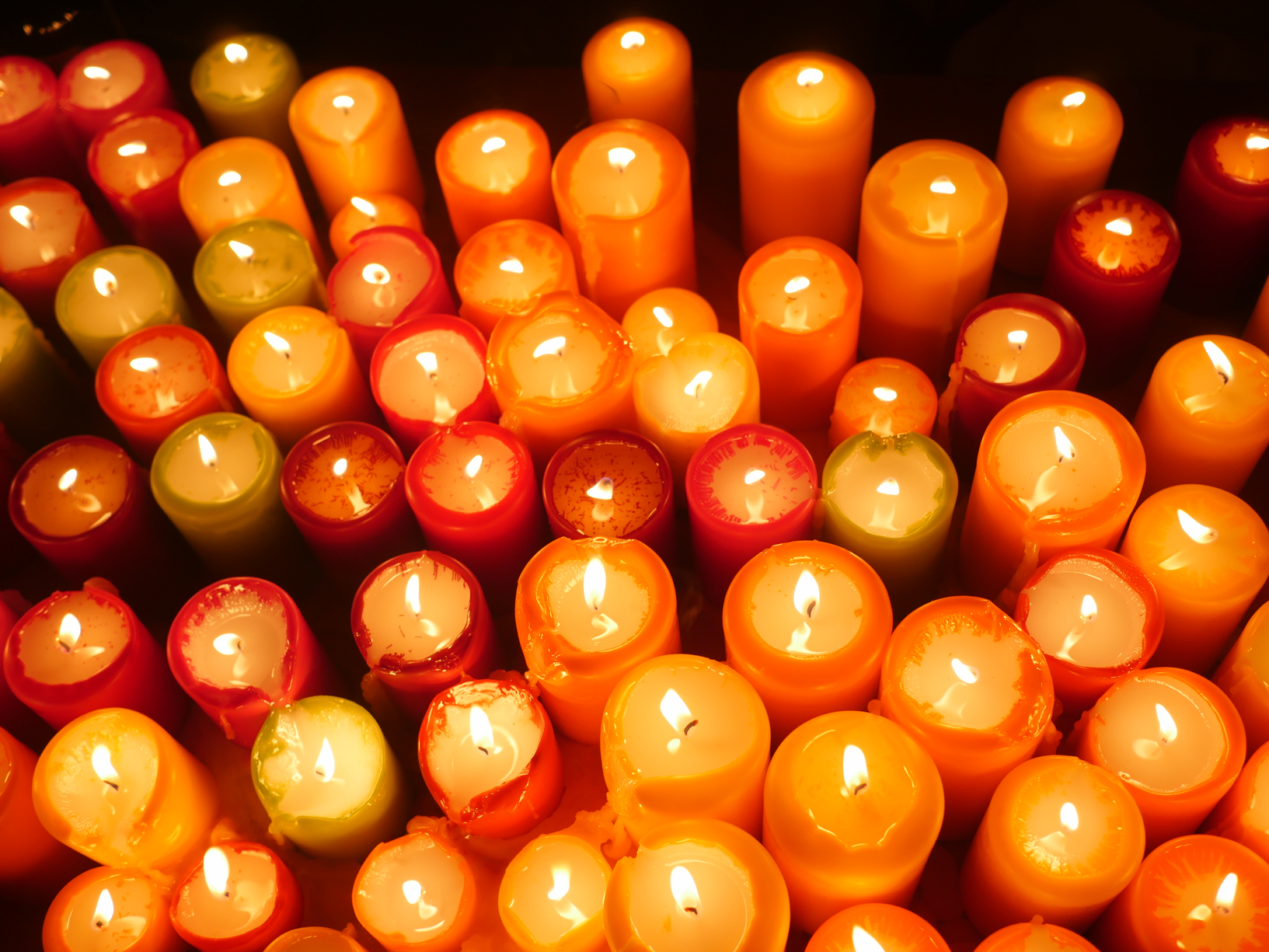 collection of lit candles