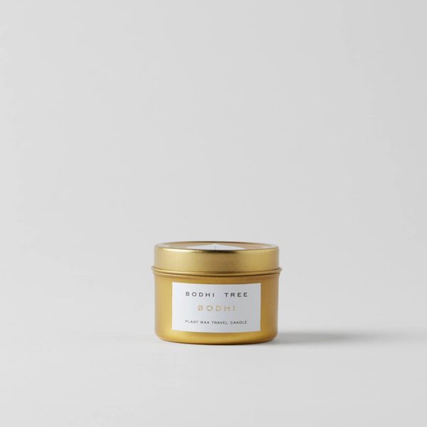single travel candle in gold colored tin
