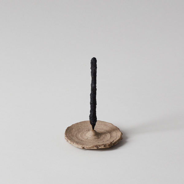 Rustic and hand-thrown pottery incense holder with incense wand